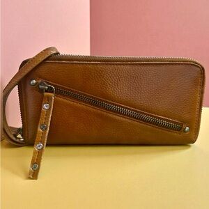 Free People Distressed Vegan Leather Wristlet Wallet in Cognac Brown.